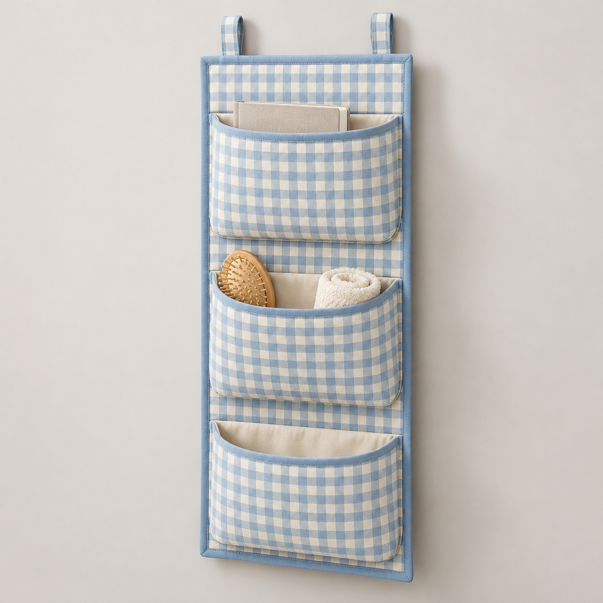 Blue Gingham 3-Pocket Hanging Storage Organiser showing pocket openings and hanging structure